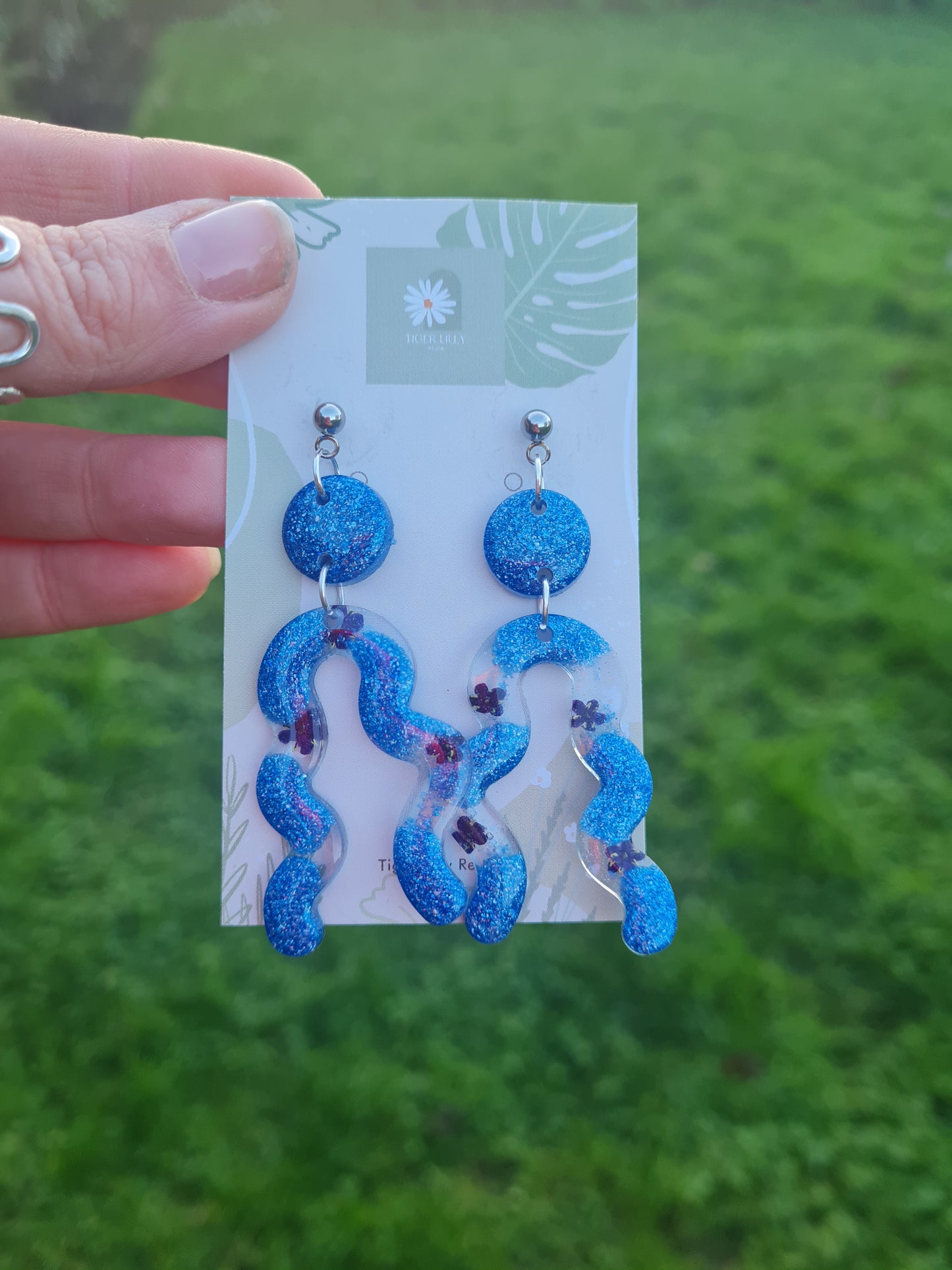 Blue floral and glitter squiggle arch earrings