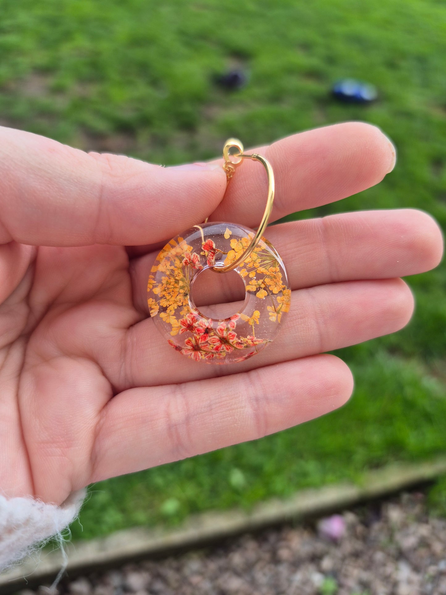Real orange floral hoop charms